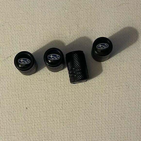 Subaru logo valve Stem caps in black set of 4 NWT - Picture 1 of 4